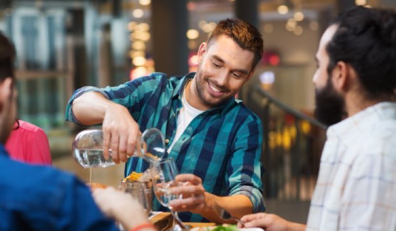 Friends celebrating with drinks and food