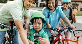 Family cycling together